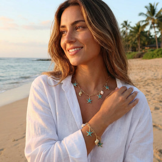 Woman on a beach wearing starfish jewelry with palm trees in the background