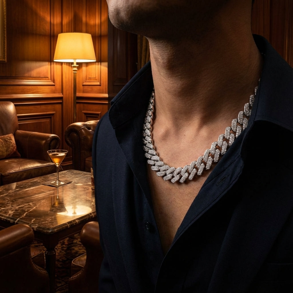 Person wearing a diamond necklace in an elegant room with a lamp and chair.