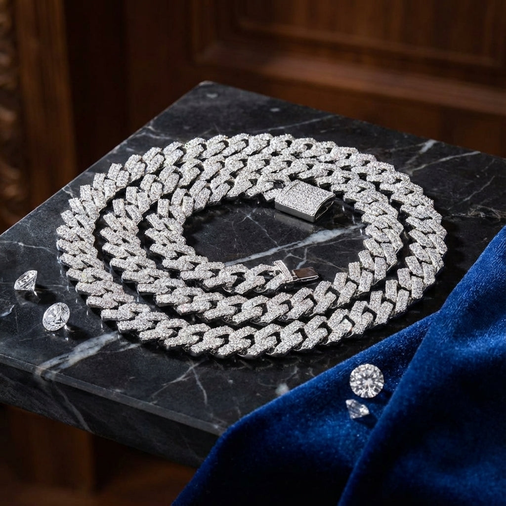Silver chain necklace with diamond-like stones on a dark marble surface.