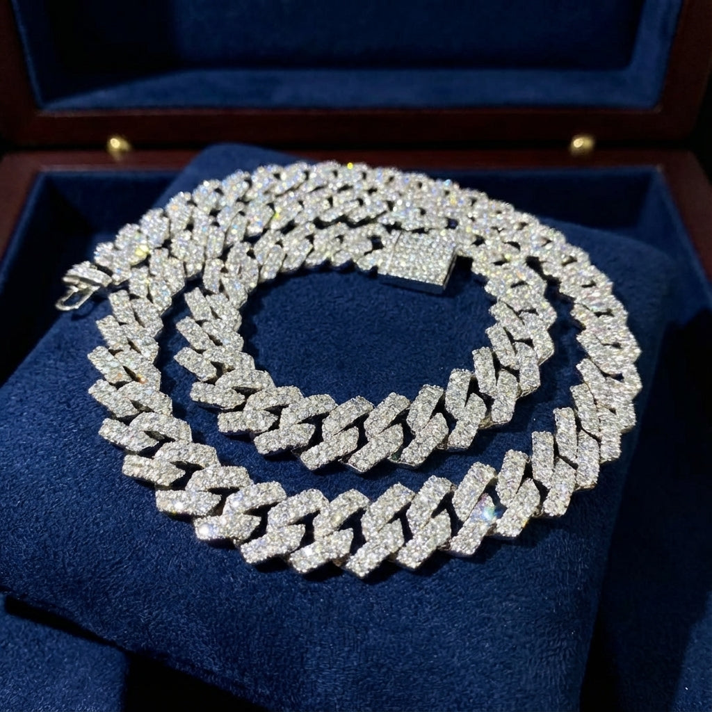 Silver chain necklace with clear stones on a blue cushion