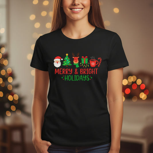 Person wearing a black t-shirt with Christmas-themed design and text, standing in a festive setting.