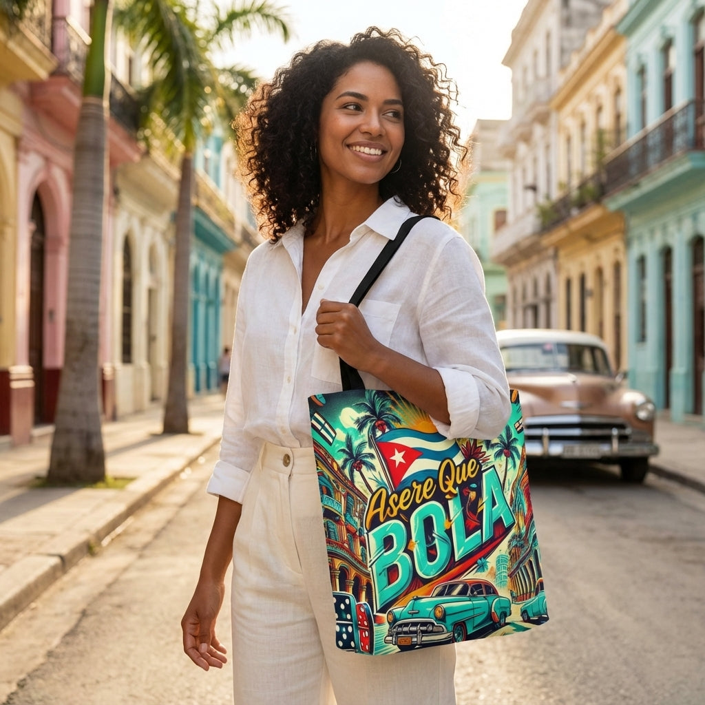 Woman holding a colorful tote bag with Cuban-themed design on a street in Cuba.