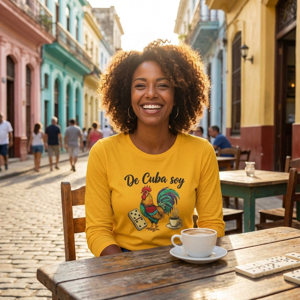 Woman in a yellow shirt with a rooster design sitting at an outdoor cafe in a colorful street.