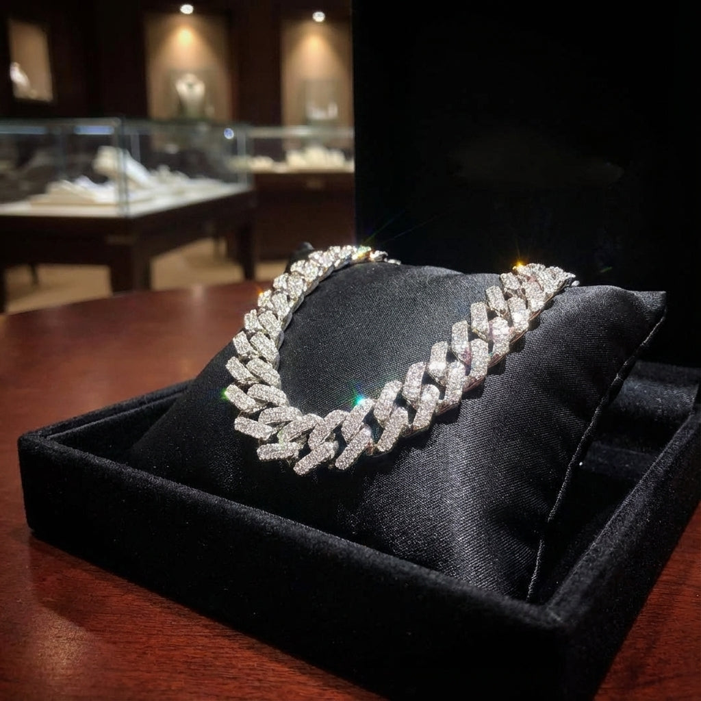 Silver necklace on a black cushion in a jewelry store setting