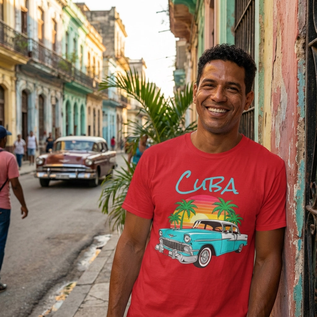 Man wearing a red 'Cuba' t-shirt with a vintage car graphic on a street in Cuba.