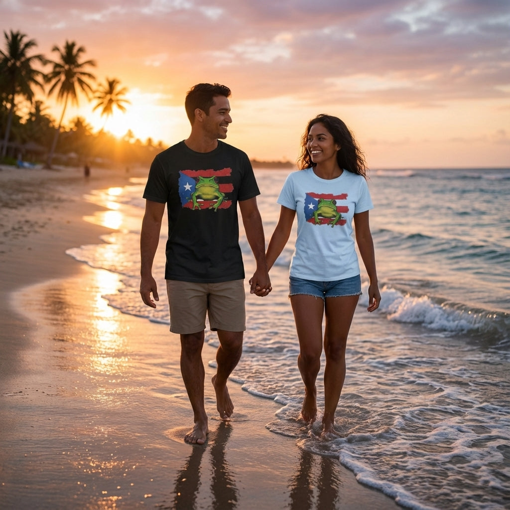 Couple holding hands on a beach at sunset, wearing matching t-shirts with a frog design.
