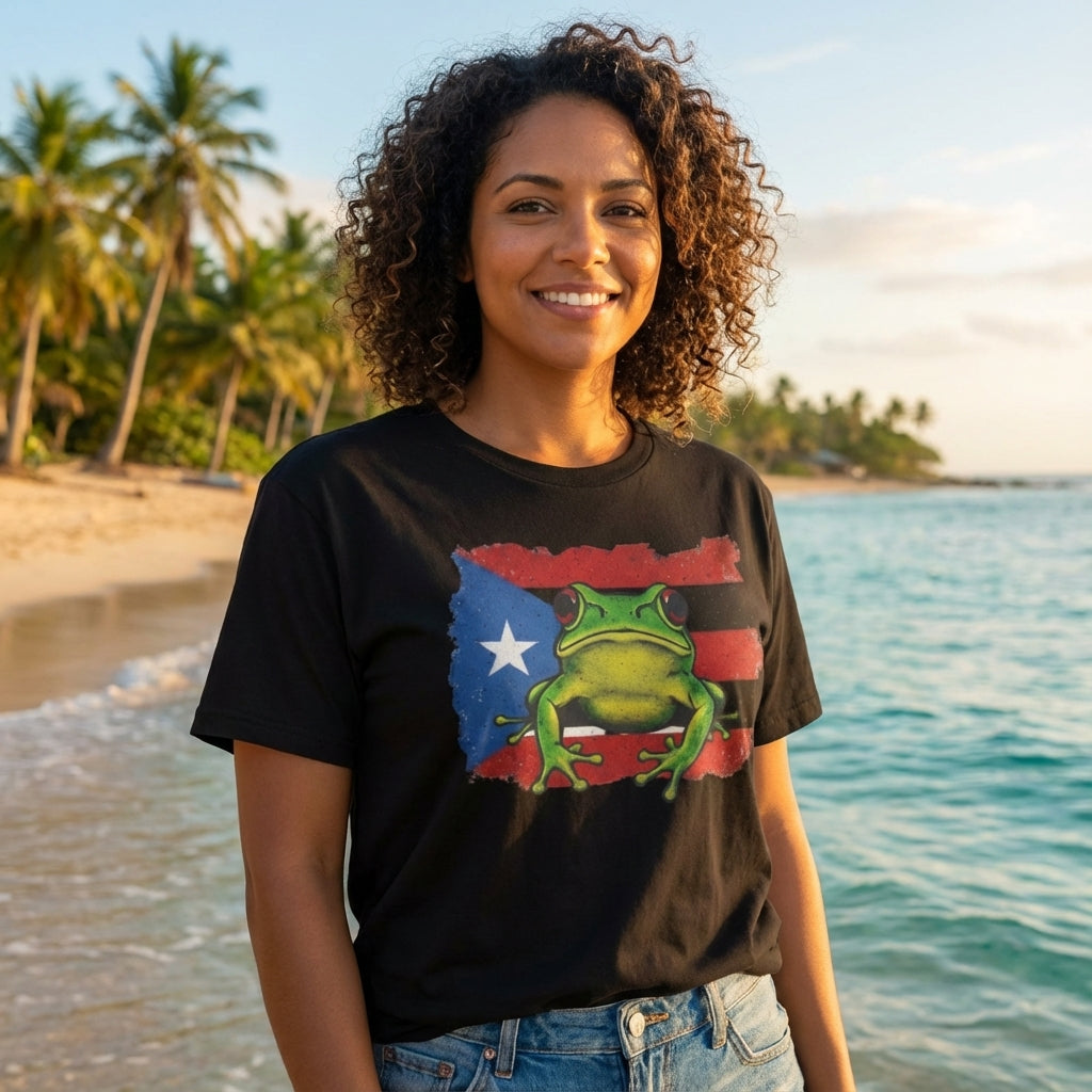 Woman wearing a black t-shirt with a colorful frog graphic on a beach
