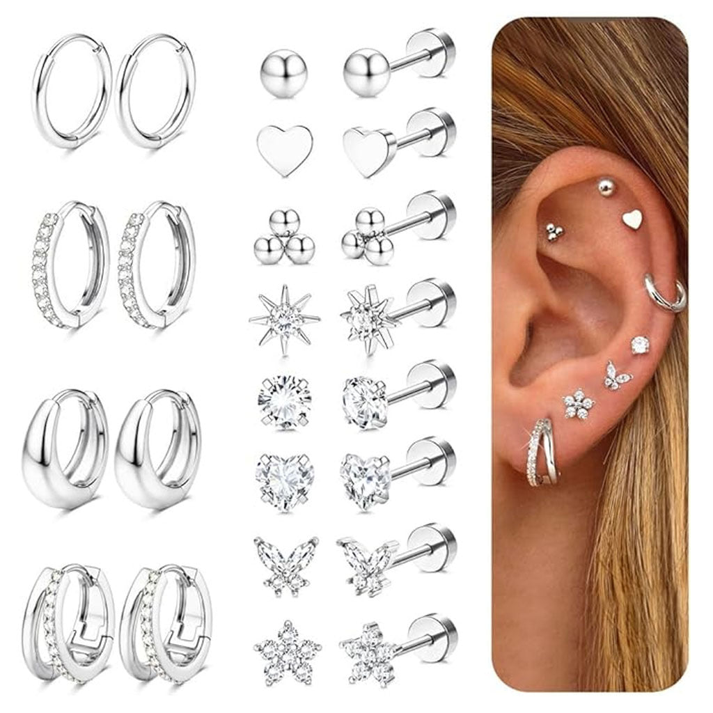 Collection of silver earrings including hoops, studs, and heart shapes with a close-up of an ear wearing some of them.