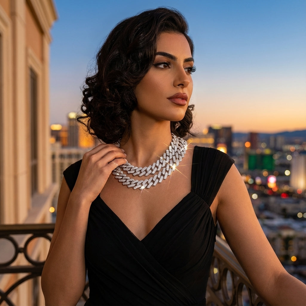 Woman wearing a black dress and silver necklace on a balcony with cityscape background