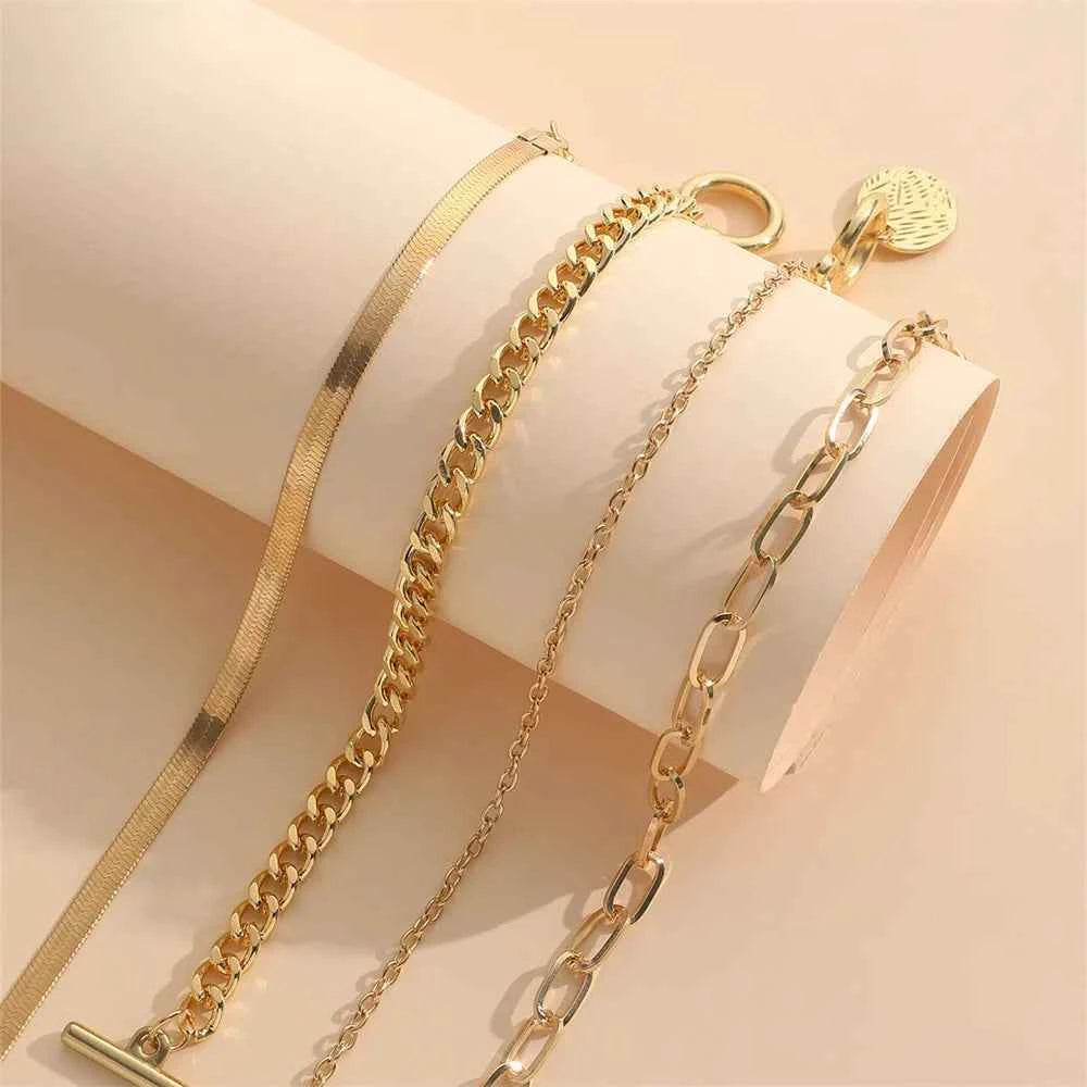 Set de 4 Pulseras de Eslabones y Cadena de Hueso de Serpiente en Tono Dorado – Estilo Minimalista y Versátil