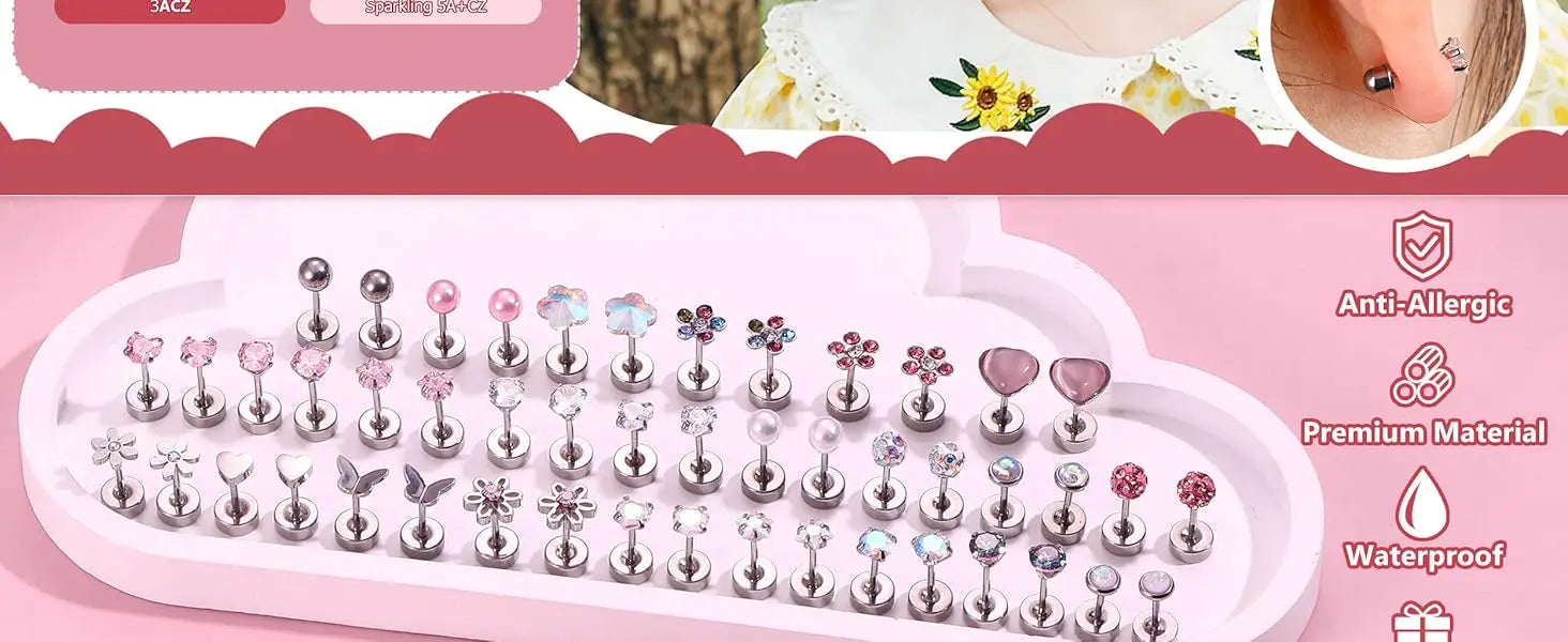 Set of earrings with various designs on a pink tray, featuring text about material and features.