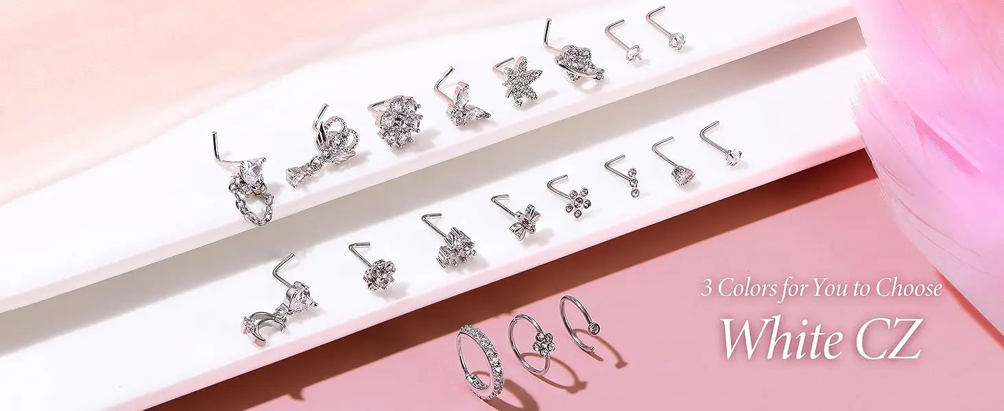 Collection of silver earrings on a pink background with 'White CZ' text.