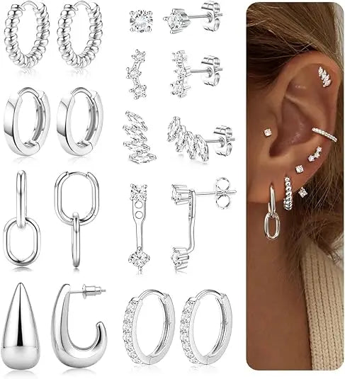 Collection of silver earrings displayed with a close-up of an ear wearing some of them.