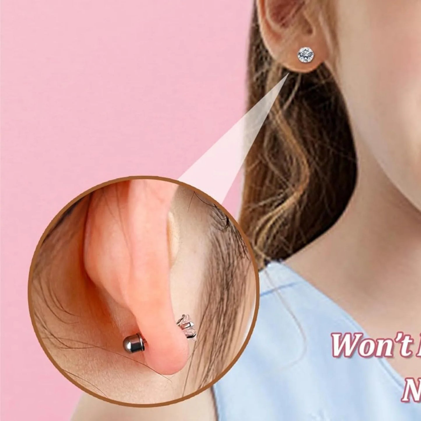 Close-up of an ear wearing a diamond earring with a pink background