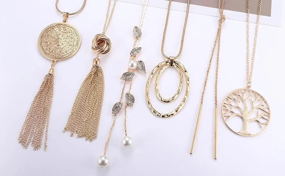 Collection of gold necklaces with various designs on a white background