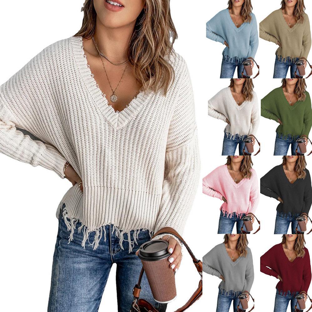 Woman wearing a white sweater with a collage of different colored sweaters.